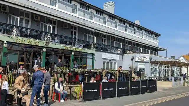 A photo of A Sunny Afternoon at a Seafront Pub
